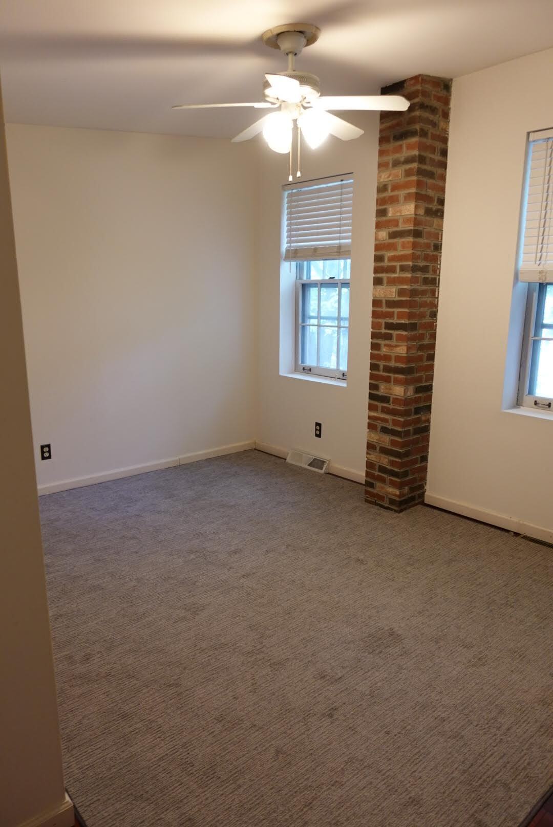 Master Bedroom with brick accent and tons of closet space! - 327 Hudson Ave