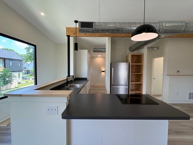 Building Photo - Vaulted Ceilings & Hardwood Floors in This Charming Indianapolis L