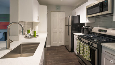 Redesigned kitchens with granite counters, stainless steel appliances and subway tile - Alister Quincy