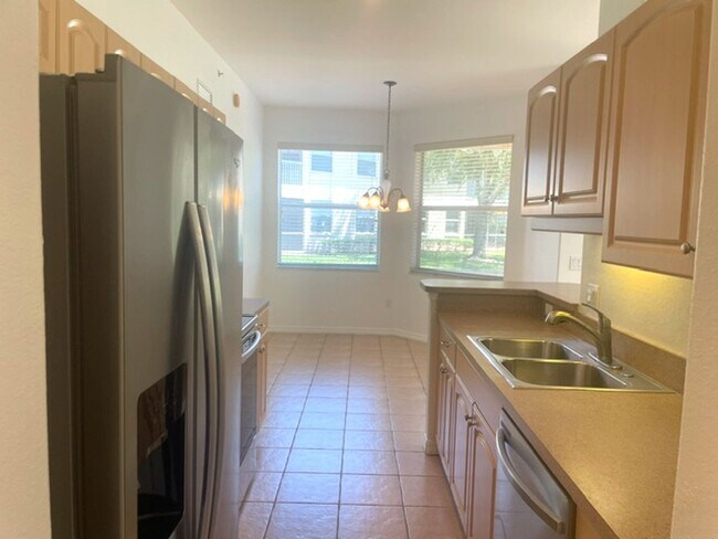 Building Photo - Elegant 3 Bedroom End-Unit Condo with Screened Lanai & Pond Views and A Private Garage