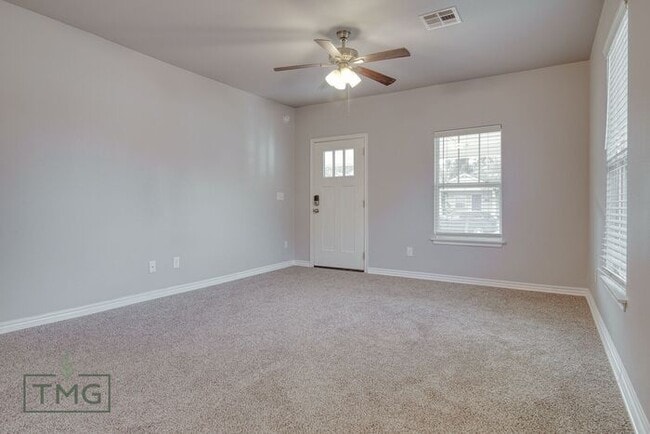 Building Photo - Spacious 3/2 with Front Porch, Fenced Yard...