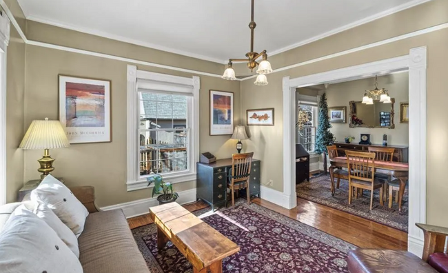 Gorgeous features showing front living room and peak into dining room off kitchen - 812 E Cache La Poudre St