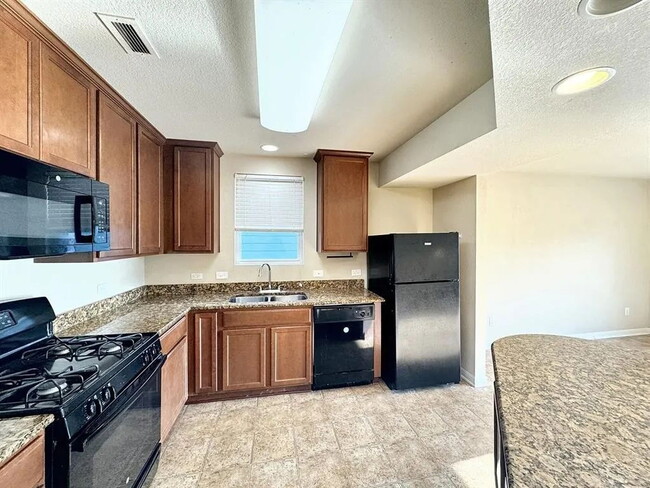 Building Photo - "Spacious 2-Bedroom Condo in San Marcos with 2 Full Baths – Experience 1,628 Sq. Ft. of Modern Co...