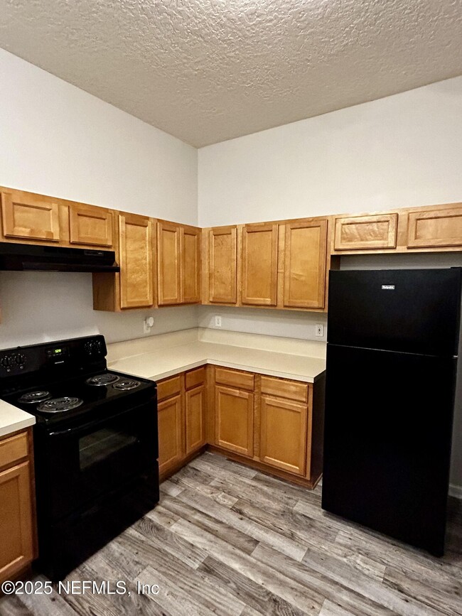 Building Photo - 6788 Manotak Oaks Dr