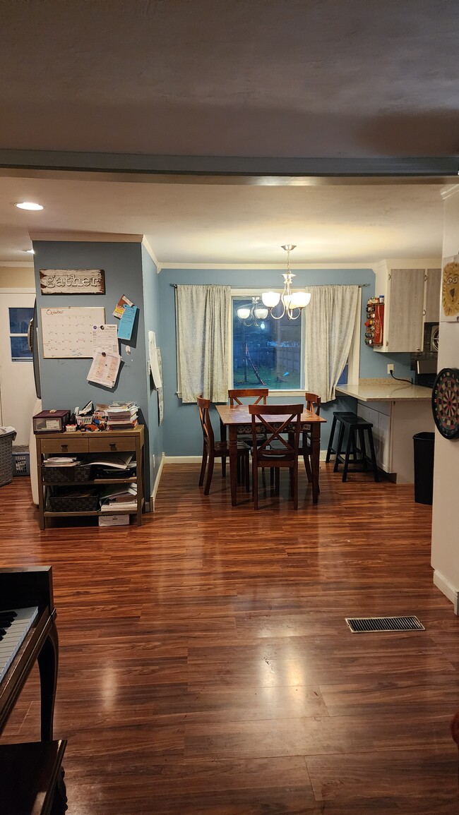 Open concept living room/dining room. - 1718 S Walden Ave