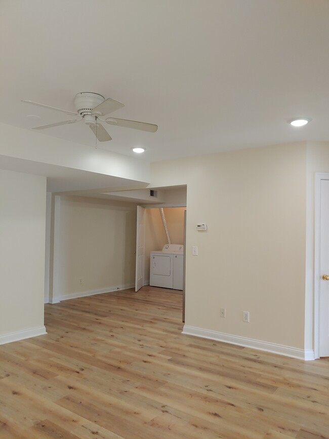 VIEW FROM LIVING AREA INTO KITCHEN/LAUNDRY - 107 Manor Dr