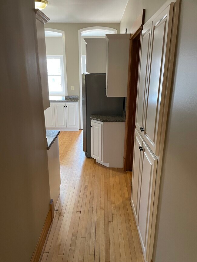 Hallway entering kitchen - 1211 W Newport Ave