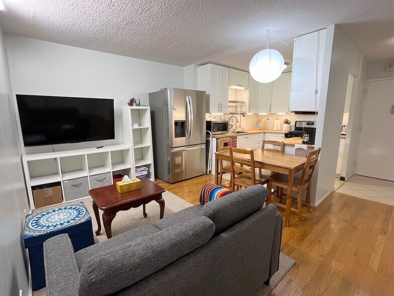 Newly renovated open kitchen connecting to dining/living area - 33 Pond Ave