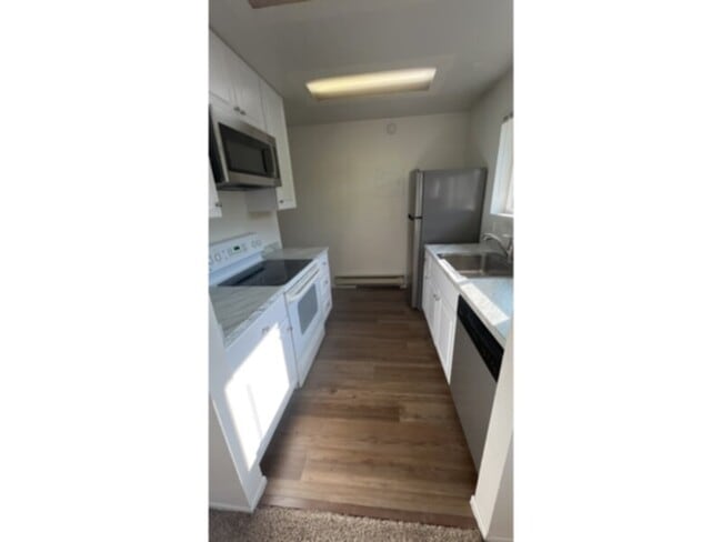 Building Photo - Tired of outdated rentals? This stunning two bedroom upper level duplex unit boasts a complete moder