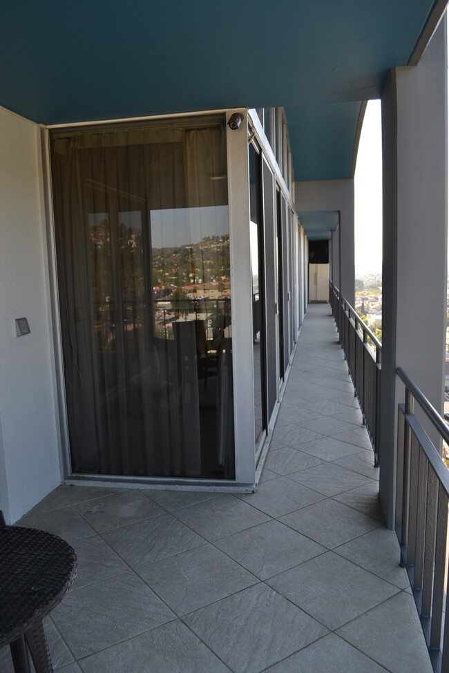 Patio with walkway toward extra refrigerator - 1155 N Brand Blvd