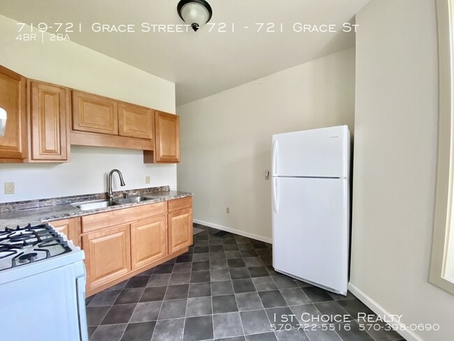 Building Photo - 4 bedroom 2 bath completely remodeled 1/2 ...