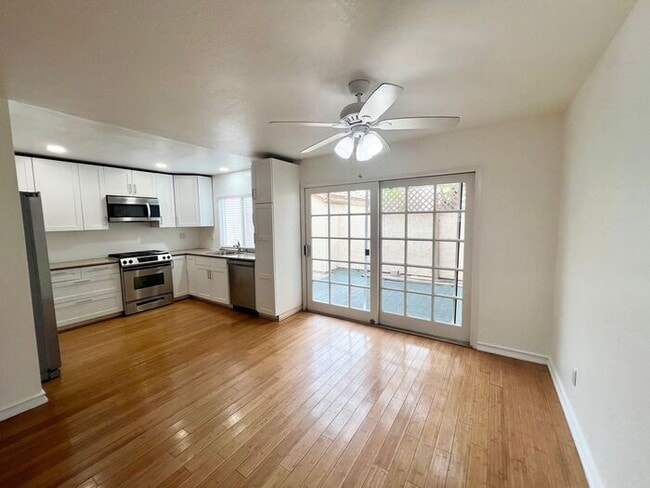 Building Photo - Stunning 4BR Townhome with Hardwood Floors, Private Patio, Community Pool & 2-Car Garage!