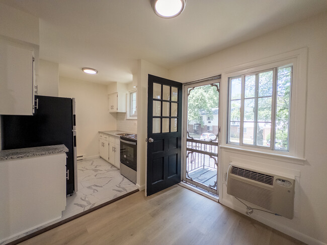 Dining Area w/ attached Balcony - Woodland Manor Apartments