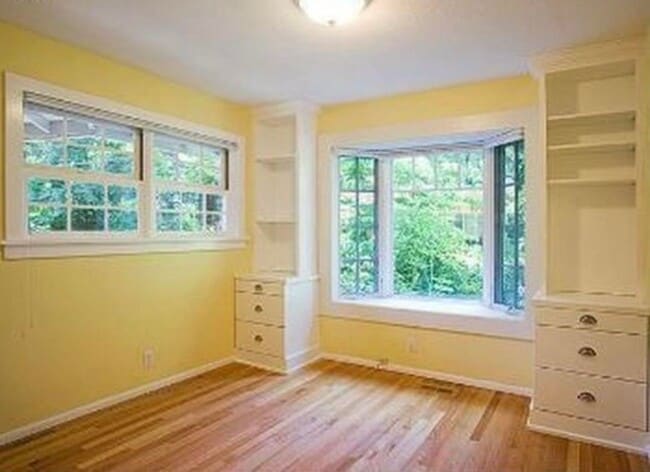 Building Photo - Spacious & light filled home with a garage, backyard, storage & hardwood floors throughout