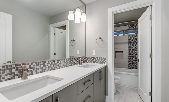 Building Photo - Bethany Stunner - 5 Bedrooms with Main-Level Bed & Bath, Modern Kitchen & Private Fenced Yard