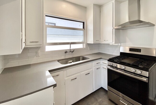 The updated kitchen is bright and well-appointed. - 1672 Rotary Dr