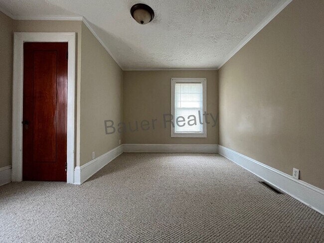 Building Photo - Three bedrooms, one and a half baths