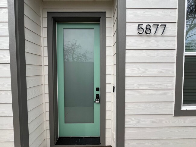 Building Photo - Modern 2-Bed, 1.5-Bath Condo with Custom Kitchen, Private Patio, and Prime Location