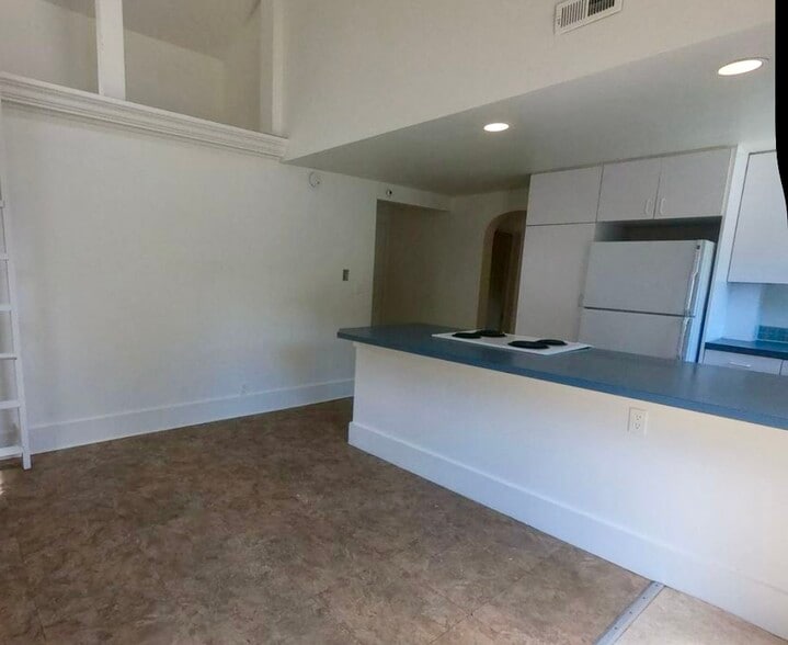 Kitchen area for dining table & chairs, counter stools. - 920 University Ave