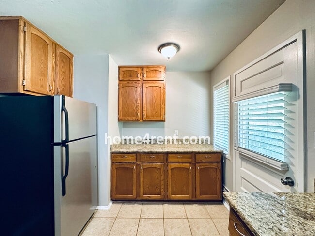 Building Photo - Attractive Prairie Village Ranch w/ FRESH PAINT, Wood Floors, Granite Counters and a Fenced Yard!