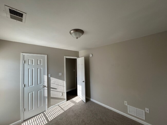 Building Photo - Spacious 4BR/2BA Olive Branch Home | 1,965 Sq Ft, Modern Fireplace, Bay Window & 2-Car Garage