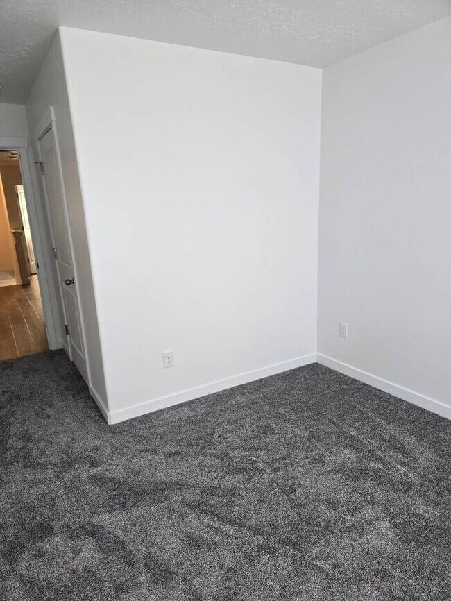 Building Photo - Nearly New, Well Appointed Modern Townhouse w 2 car attached garage