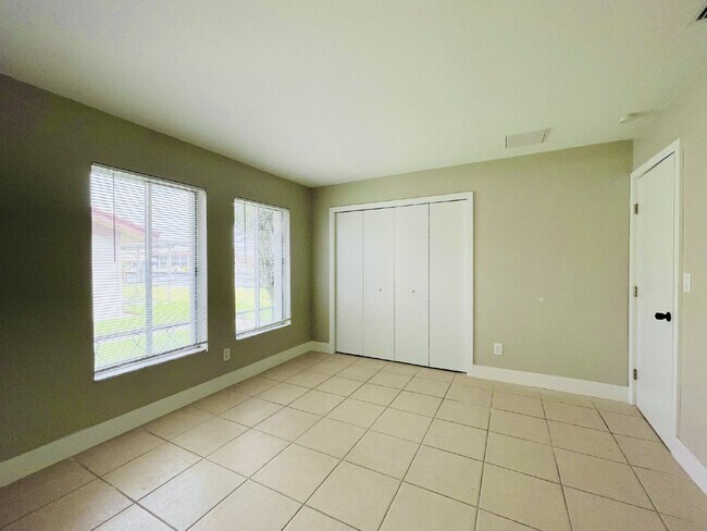 Building Photo - Updated 2-bedroom waterfront duplex with walk-in closets, enclosed Florida room, and canal views ...