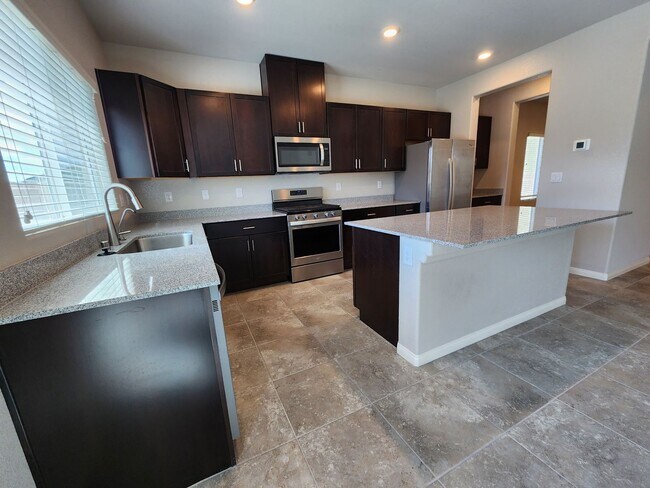 Building Photo - A Fairly New Home with 5 Bedrooms in a gated community