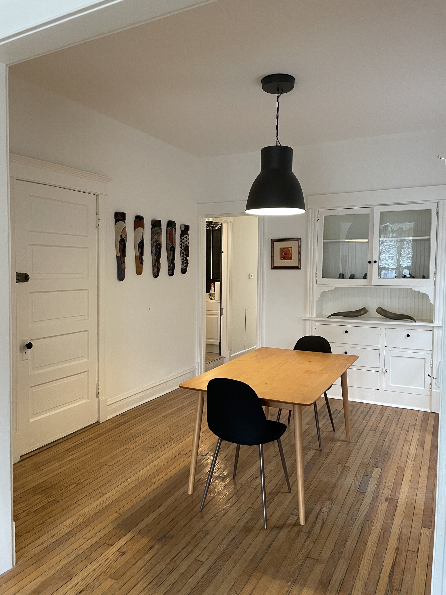 Dining room has an antique built-in for extra storage. - 3489 N Elston Ave