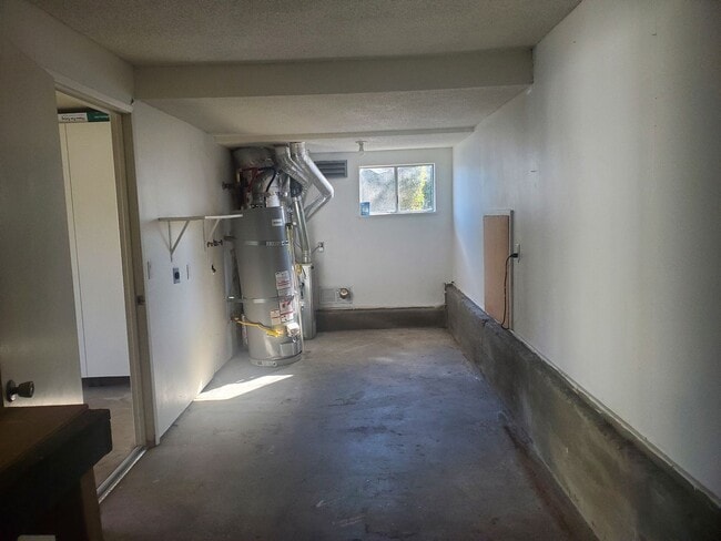 Building Photo - Private 2x2 Santa Rosa Townhouse with pool, 2-car garage, workshop area, fireplace, W/D Hookups