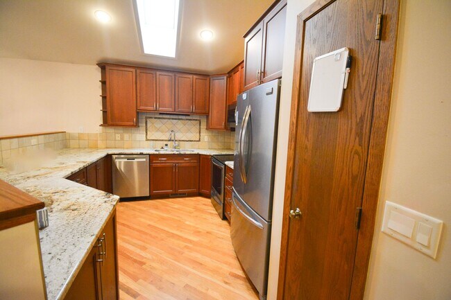 Building Photo - 3-Bedroom NE Rochester home with Sunroom, Fenced Backyard & Attached Garage