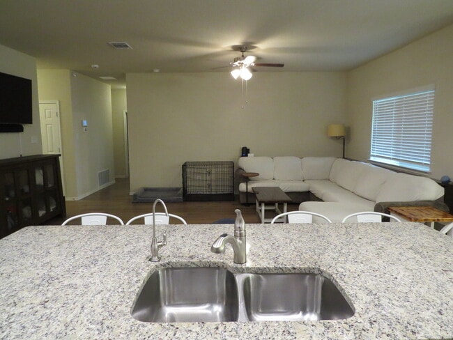 Building Photo - "Charming 3-Bedroom Home with Elegant Gran...