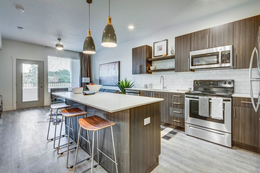 Where style meets functionality. Cook, gather, and create in a kitchen designed for modern living. - Elevation 56