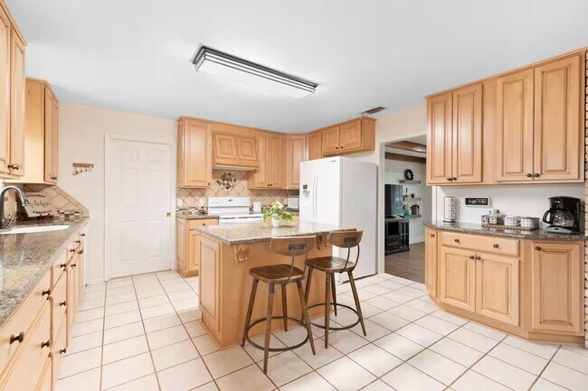 Building Photo - 3 Bed, 3 Bath Home with Expansive Kitchen, Two Living Areas & Private Suite