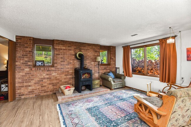 Building Photo - 2700 + sq ft family home has it all! Over 2 acres of land and a stunning view of Lake Pend Oreille