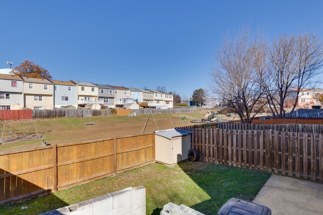 Building Photo - Spacious end-unit three-level townhome featuring 2 bedrooms and 2.5 bathrooms