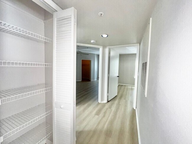 Building Photo - NEW-Remodeled bathroom & kitchen! NEW VINYL PLANK flooring & fresh paint! 2 bedroom 1 bath condo ...