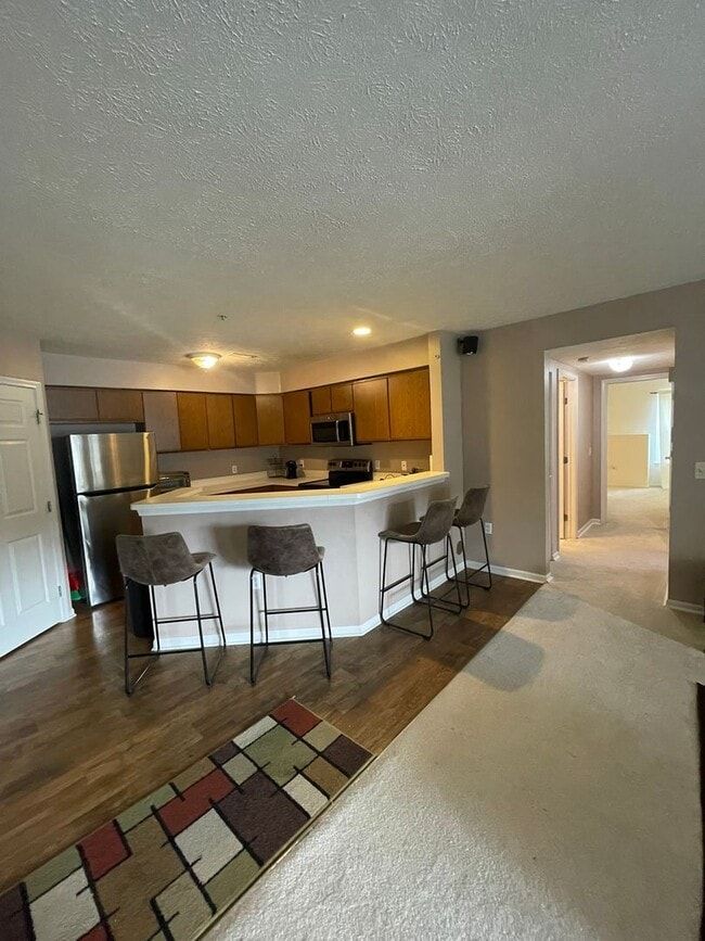 Building Photo - Move-In Ready Condo – Furniture is Optional