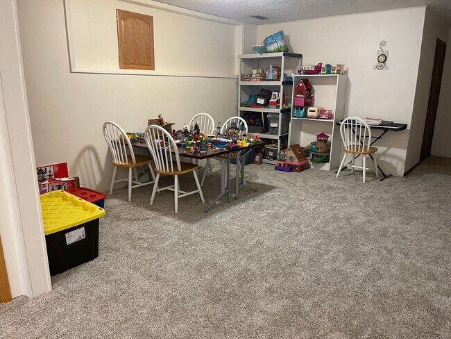 Building Photo - Spacious, four-bedroom, two-bathroom, coun...
