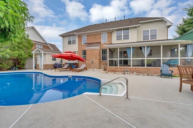 Building Photo - Beautiful brick home with a saltwater pool