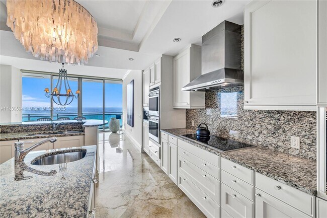 Building Photo - 10295 Collins Ave