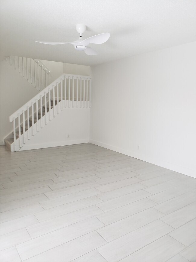 Living room, whole townhouse painted in July 2022. - 7594 Courtyard Run W