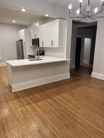 New kitchen open to dining room and main hallway - 1049 Franklin Ave