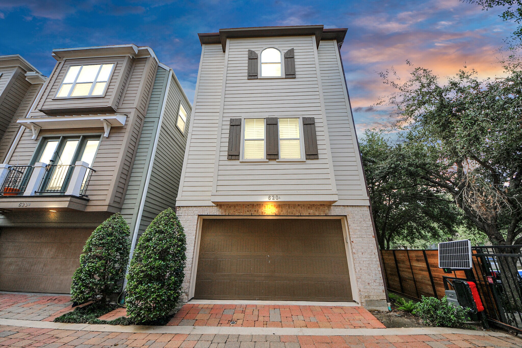At dusk, soft lighting highlights the home’s architectural grace. - 620 Rutland St