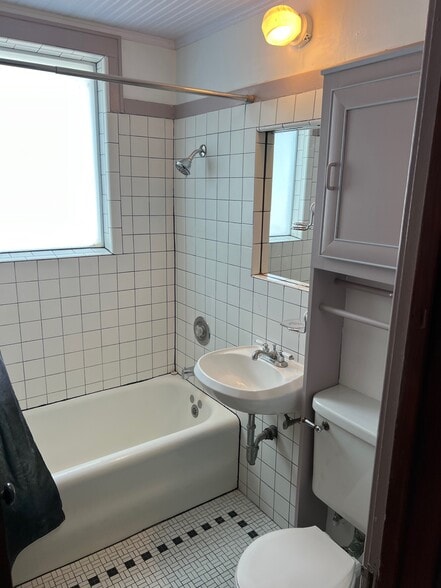Full Bathroom With Shower Over Tub. Original Tiled Floor - 6326 W Grant St