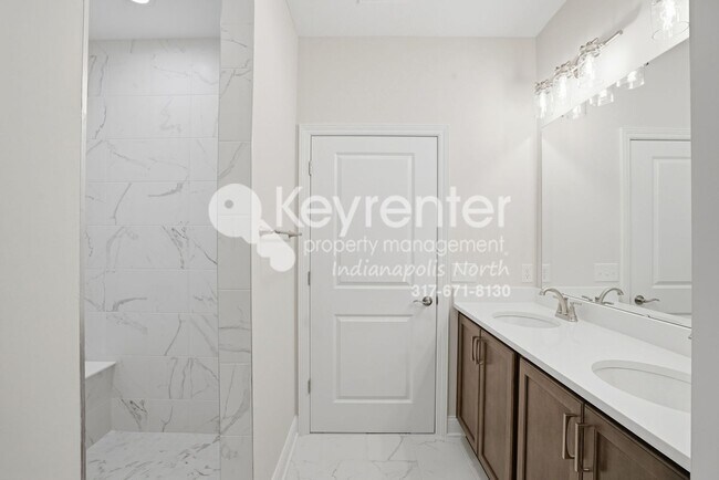 Building Photo - Located in Westfield, IN, this attractive 3-bedroom, 2.5-bath home sits on a corner lot within an...