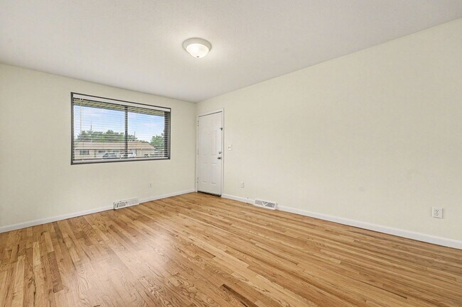 Building Photo - Spacious 3-Bedroom Home with Refinished Hardwood Floors, Fresh Interior Paint, Private Fenced Yar...