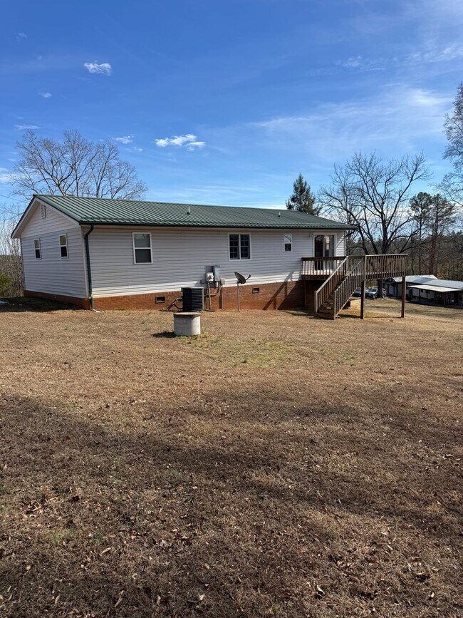 Building Photo - Spacious 4-Bedroom Rural Home on Private Acreage