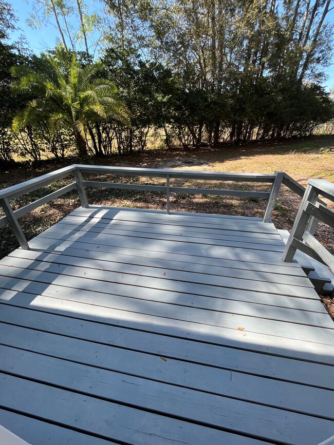 Building Photo - 3/2  home fenced in backyard located acros...