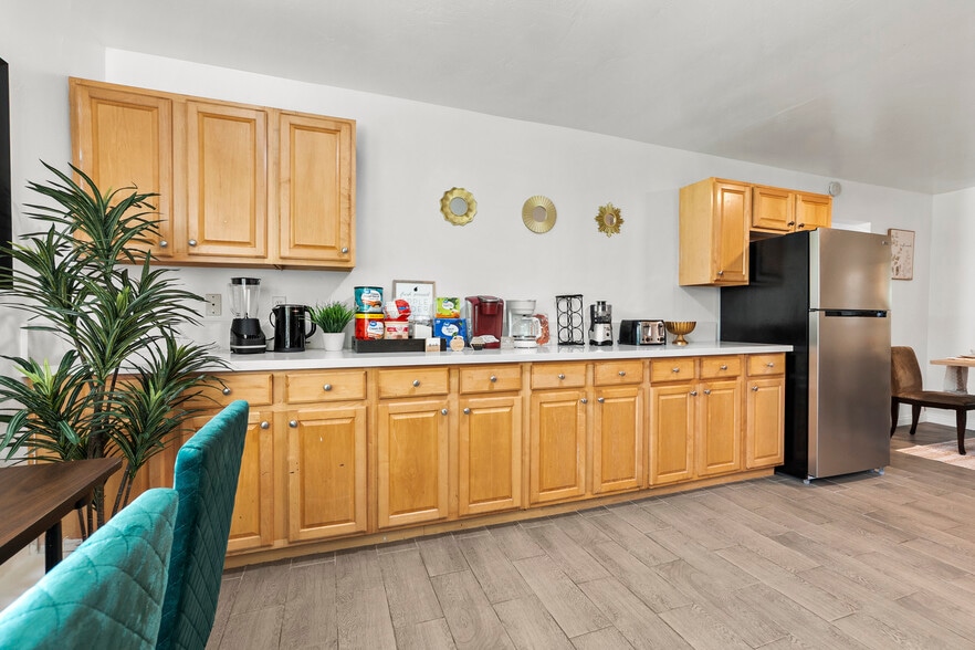 Fully stocked kitchen with a coffee maker, perfect for your morning brew! - 4989 Randlett Dr